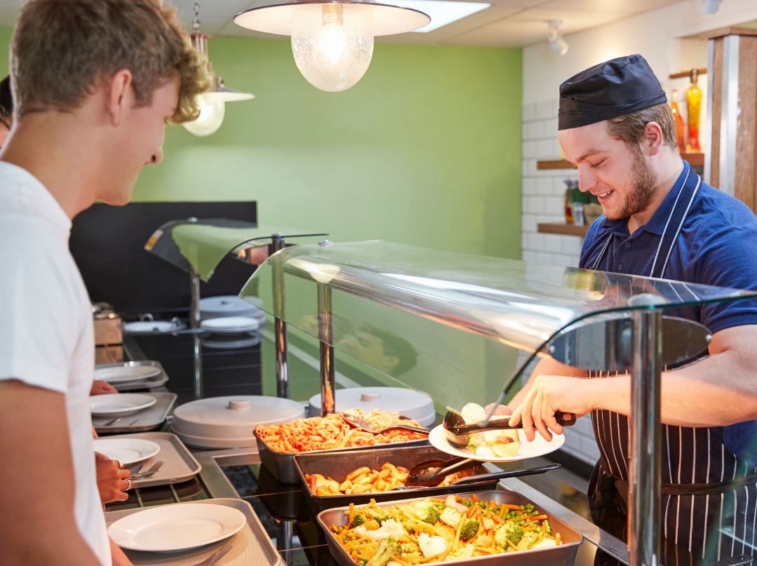 student getting food in dining hall