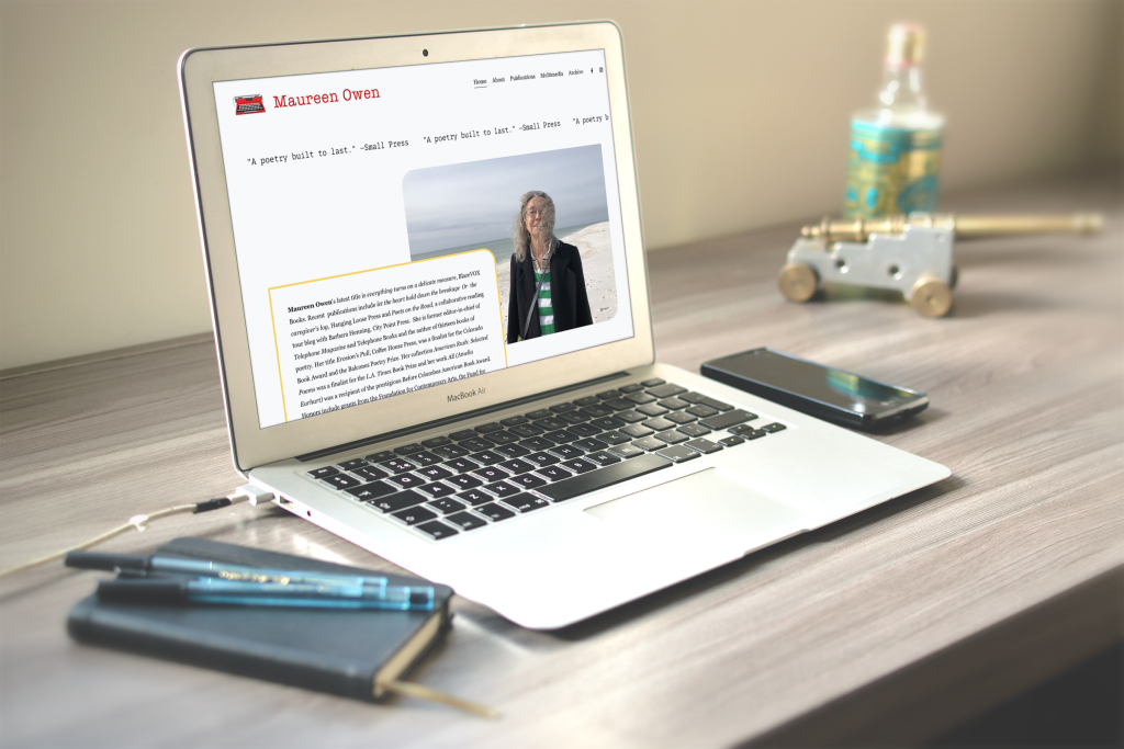 Open laptop with author website of Maureen Owen on the screen