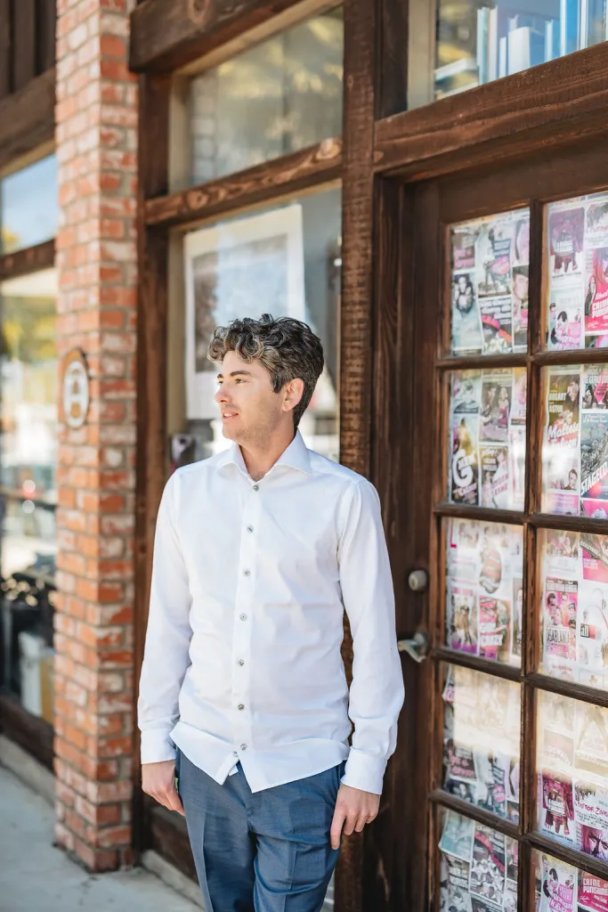 Matthew stands in front of DG Wells bookstore in La Jolla California