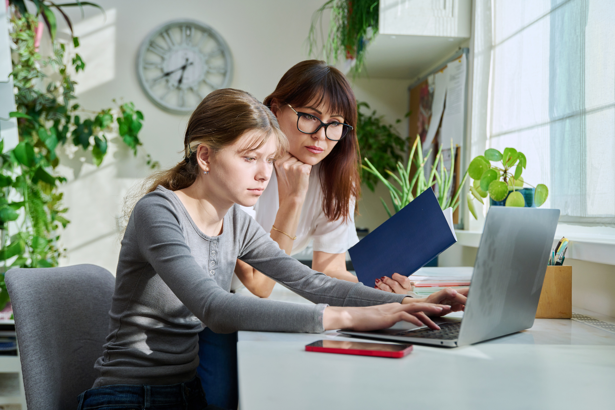 Mom and teen working on FAFSA