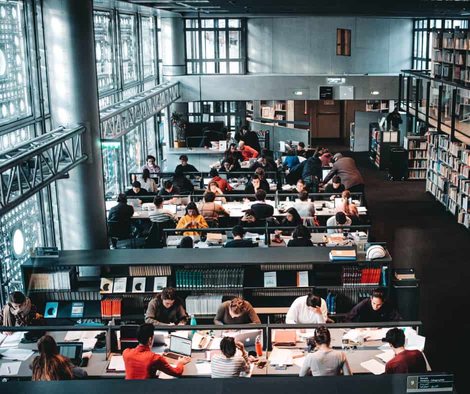 students studying in college library