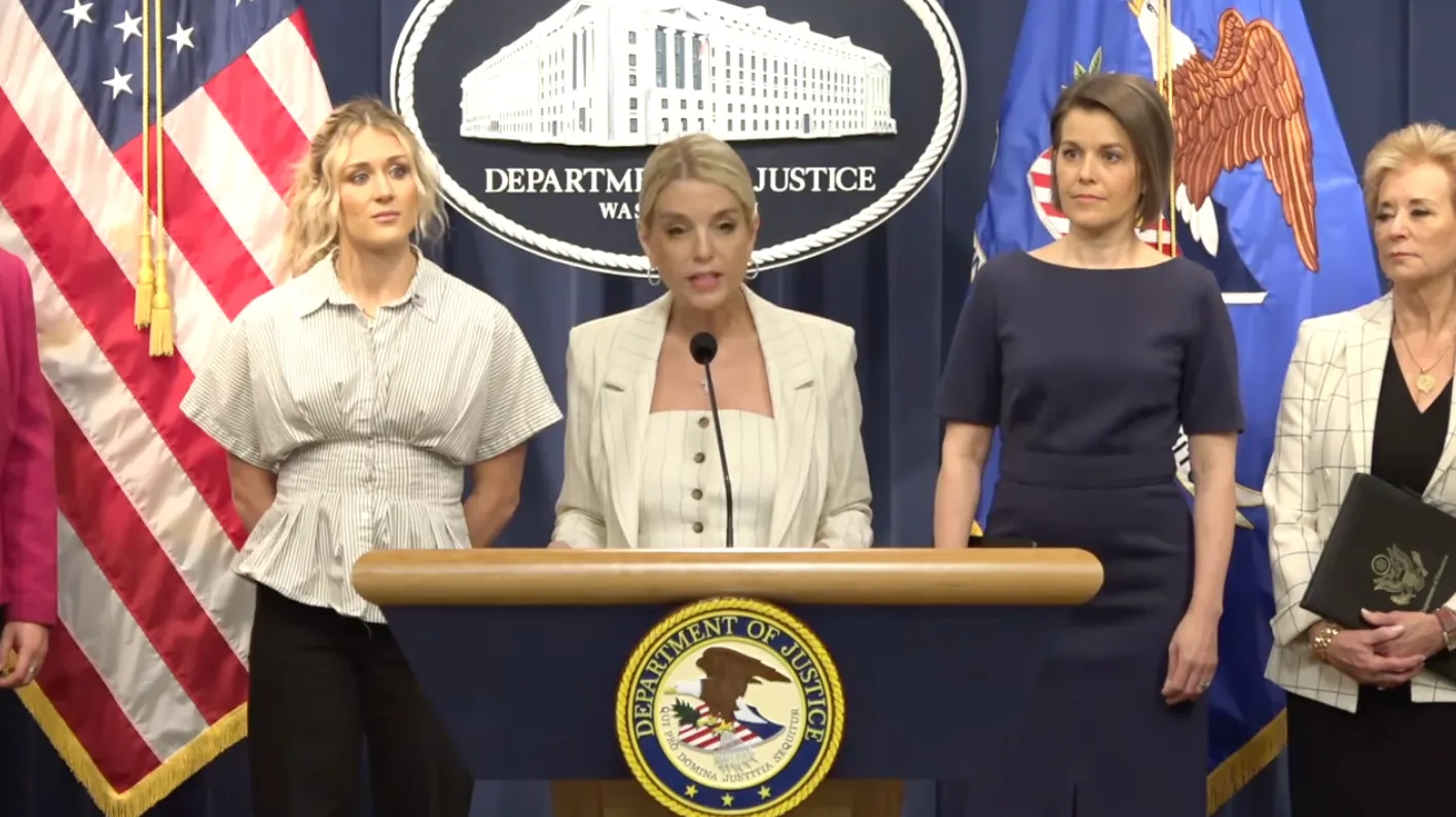 U.S. Attorney General Pamela Bondi is pictured speaking into a podium next to U.S. Secretary of Education Linda McMahon