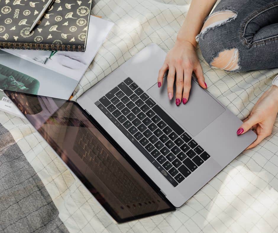 searching for information on laptop to stay informed