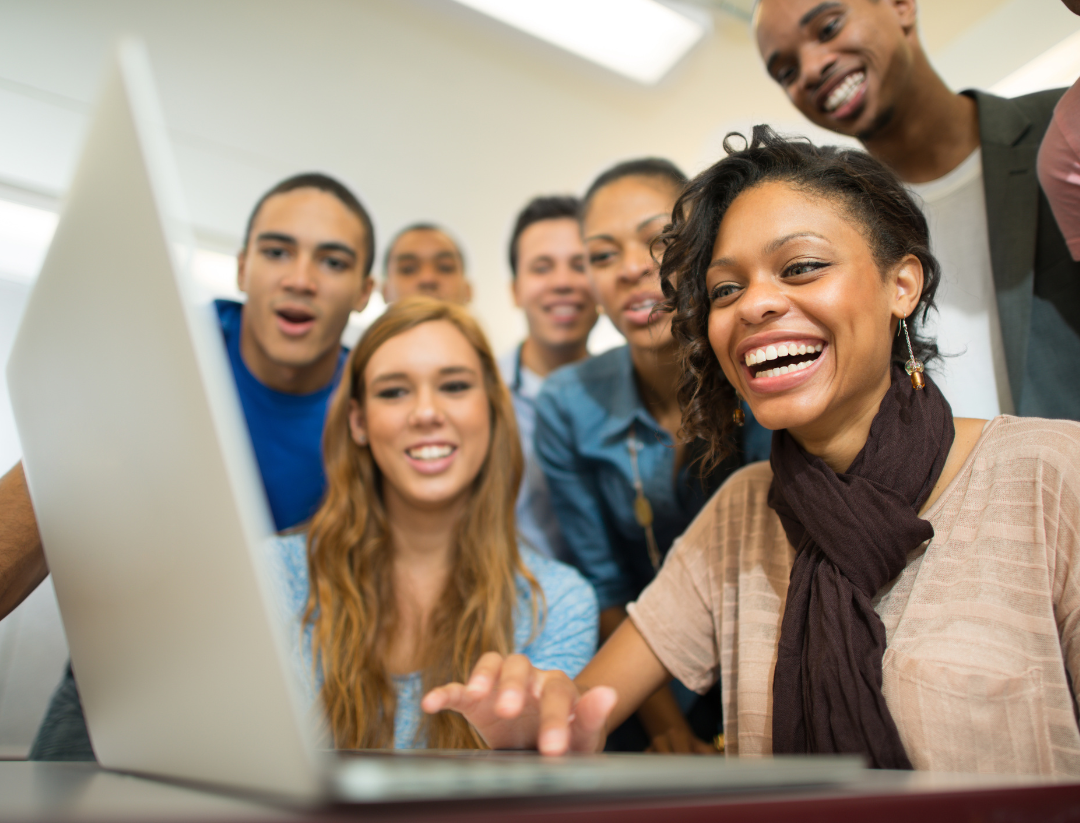 scholarship winner surrounded by friends - hidden funding sources to pay for college