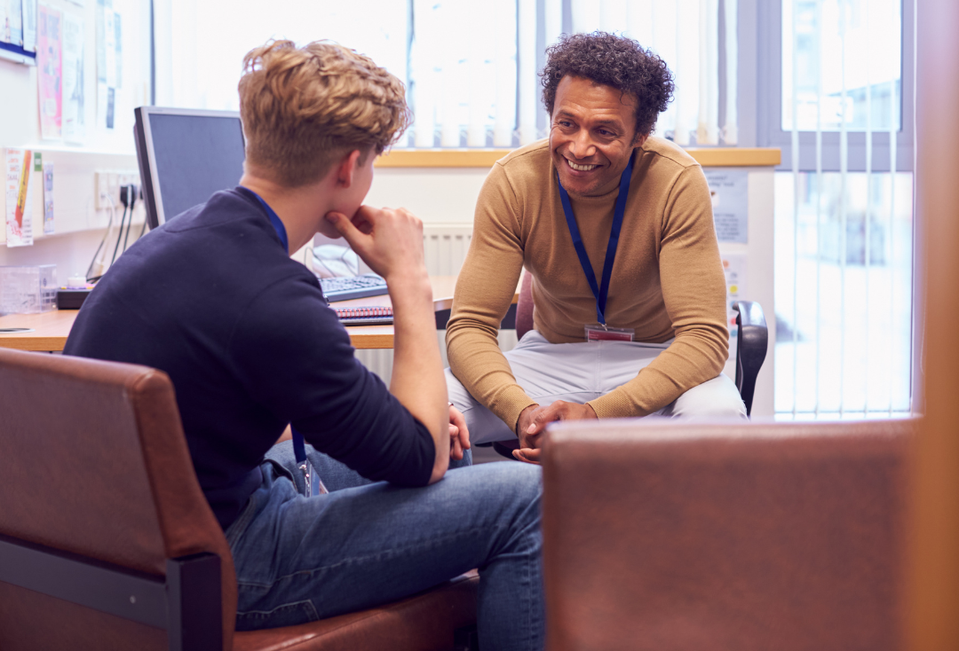 college student meeting with teacher