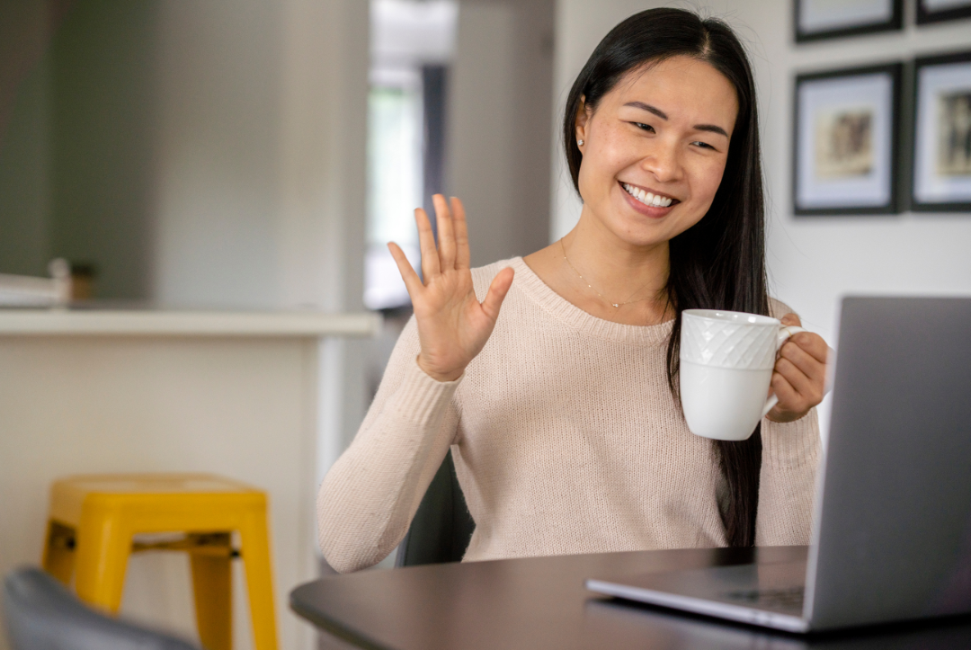 student attending virtual event on laptop