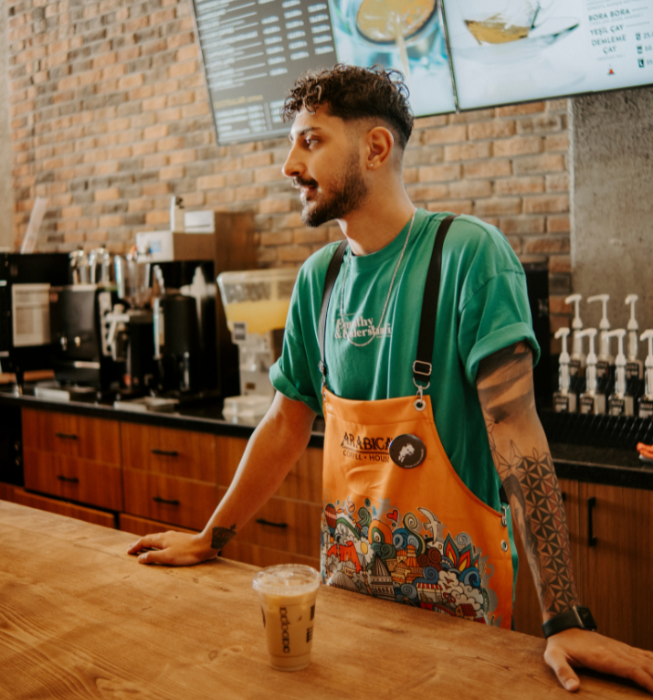 college student working at a coffee shop
