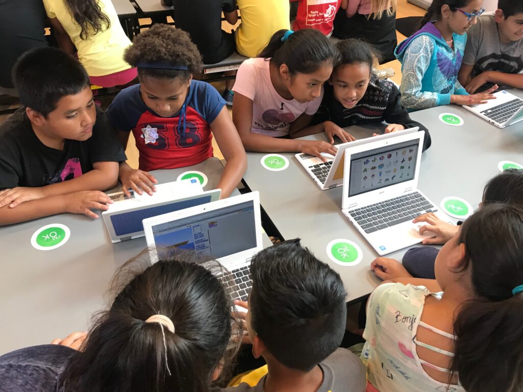 Children working together on Chromebooks